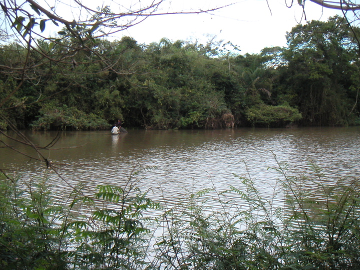 Two guys fishing on the river outside of Urubicha.  Apparently it is full of paranas and anacondas!  We saw green macaws fly overhead.