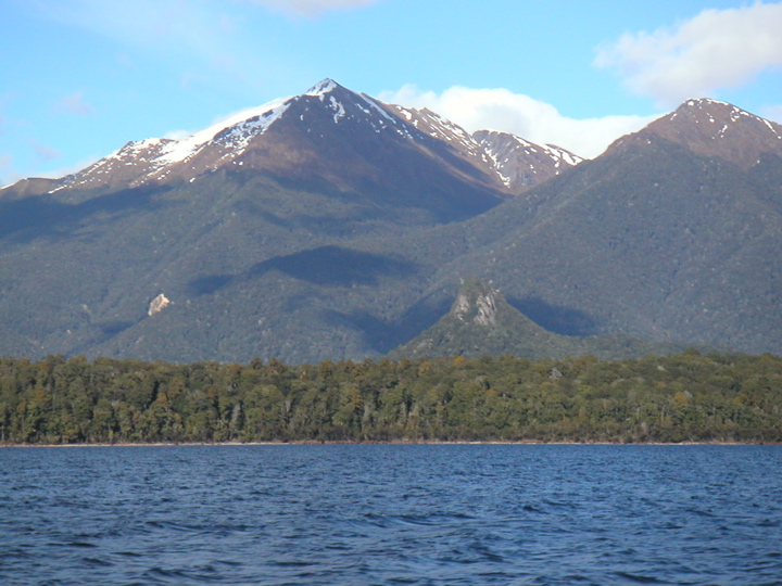 The next morning, I was signed up for an all day excursion to Doubtful Sound.  To get there, we first took a small motorboat across Lake Manapouri, seen here.  The small pointy structure beneath the mountains used to be the molten interior of a volcano, and made an appearance in Lord of the Rings.