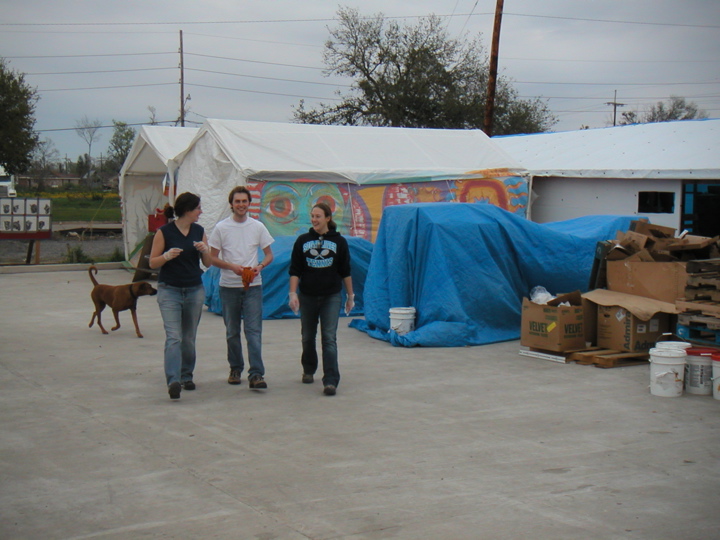 Katie, Nick, and Sara are walking in front of "Distro", the distribution center where residents could come for free supplies.