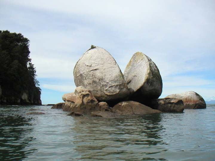 Showing people this picture, I've heard many different interpretations, but the "official" name is Split Apple Rock.  Pretty cool eh?